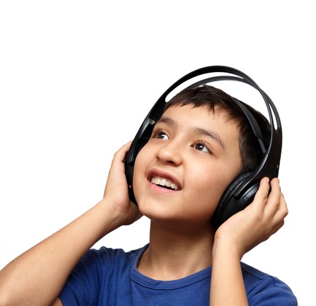 boy listening music in headphones isolated on whiteの写真素材