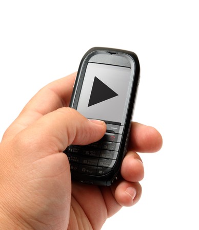 mobile phone in man hand with music play signの写真素材