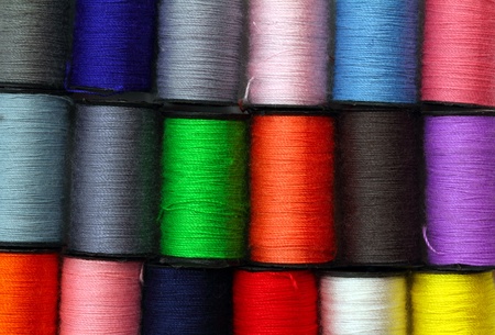 lot of colored thread spools - backgroundの写真素材
