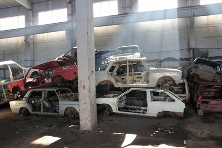 heap of cars is returned for recycling as scrap metalの写真素材