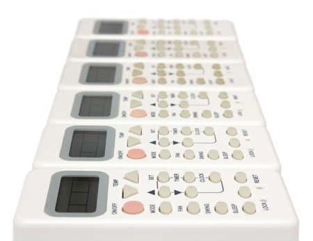 remote infrared devices in row isolated on whiteの写真素材