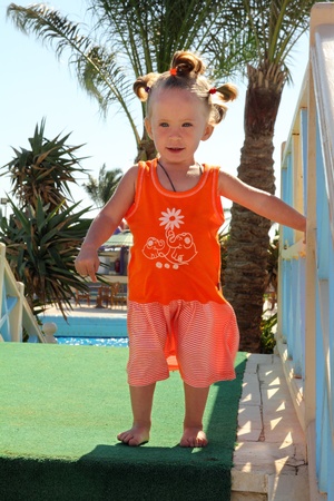 outdoor shot of happy little girl standingの写真素材