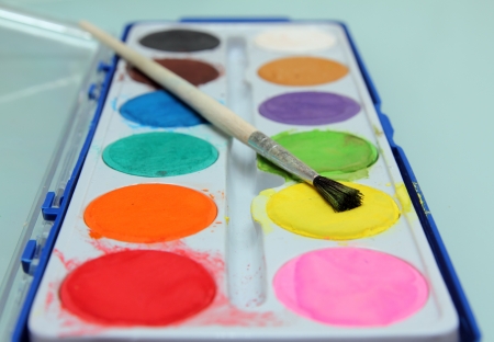 set of water-colour paints and brush close-upの写真素材