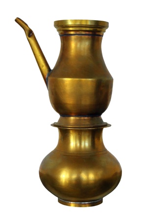 old indian copper teapot isolated on whiteの写真素材
