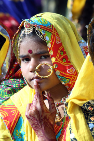 PUSHKAR, INDIA - NOVEMBER 21: Portrait of Indian girl in colorful ethnic attire at Pushkar camel fair on November 21, 2012 in Pushkar, Rajasthan, India. のeditorial素材
