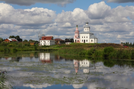 Church of Elijah the Prophet reflected in Kamenka river - Suzdal Russiaの写真素材