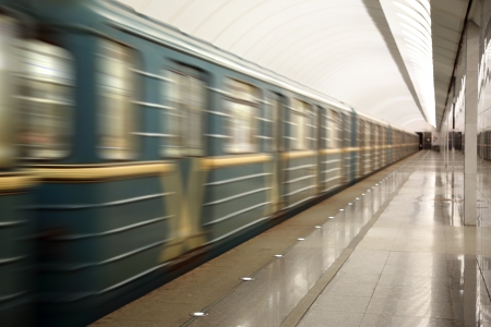 train fast moving at subway station 