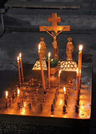 kanun - remembrance table with candles and crucifix in churchのeditorial素材