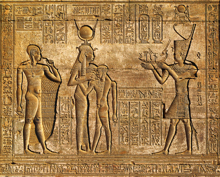Hieroglyphic carvings on the exterior walls of an ancient egyptian temple