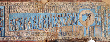 Hieroglyphic carvings and paintings on the interior walls of an ancient egyptian temple in Denderaの写真素材