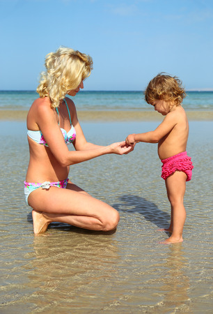 mother and daughter on the beachの写真素材