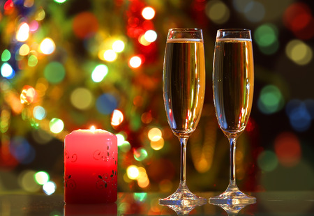 glasses with champagne and candle - romantic eveningの写真素材