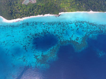 Top aerial view from flying drone of beauty nature landscape with tropical beach with boats and sea in Thailandの写真素材