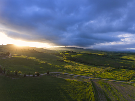 Tuscany aerial sunrise farmland hill country landscape. Italy, Europe.