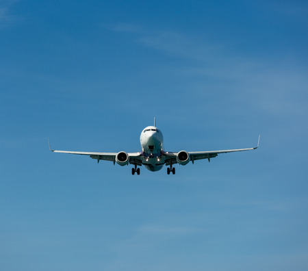 Passenger airplane in the clouds before landingの写真素材