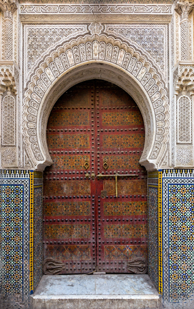 Traditional entrance gate with door in Fes, Moroccoの写真素材