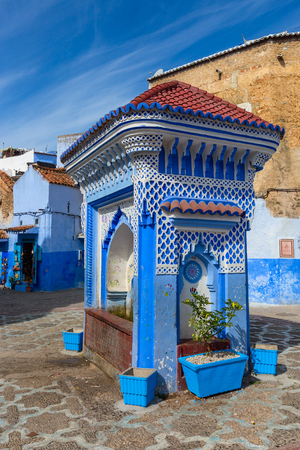 Public fountain of the Plaza El Hauta, square in medina of Chefchaouen, Moroccoの写真素材