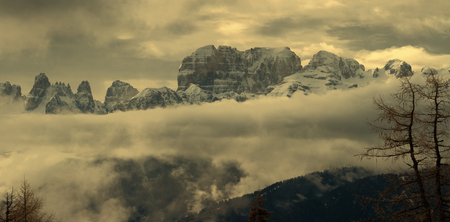 Snow-capped mountains in clouds panorama landscape in alps, Adamello Brenta, Italyの写真素材