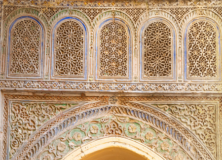 Fragment of an old wall decorated with stone carvings in Moroccoの写真素材