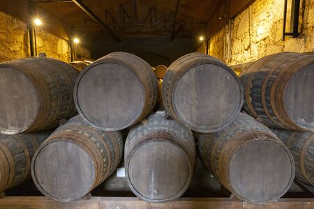barrel filled with port wine in wine cellar