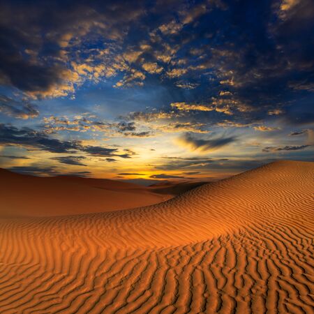 beatiful landscape with sand dunes in Sahara desert at sunsetの写真素材
