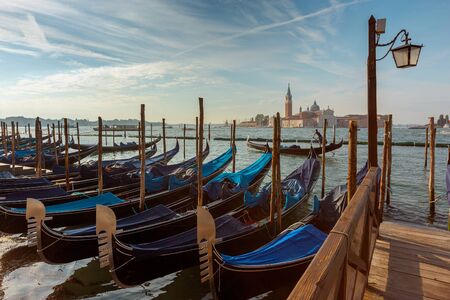 Traditional Gondolas on Canal Grande with San Giorgio Maggiore church in the background at morning, San Marco, Venice, Italyの写真素材