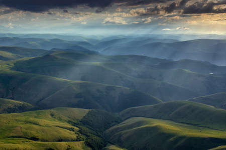 Sunbeams on hills in Caucasus mountains