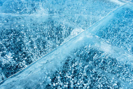 blue ice and frozen methane bubblesの写真素材