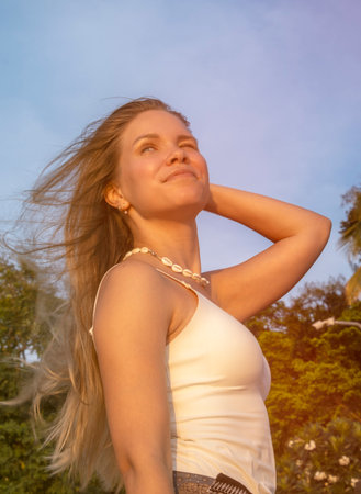 Young woman portrait with flowing hairの写真素材