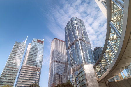 Skyline view of modern skyscrapers under a clear blue sky