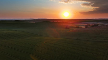 Aerial view of amazing wavy hills with agricultural fields at sunset. South Moravia region, Czech Republic, Europeの写真素材