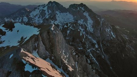 Aerial view of amazing rocky mountains in snow at sunset, Komovi, Montenegroの写真素材