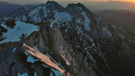 Aerial view of amazing rocky mountains in snow at sunset, Komovi, Montenegroの写真素材