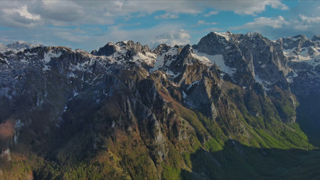 Aerial view of amazing rocky mountains in snow before sunset, Prokletie, Montenegro