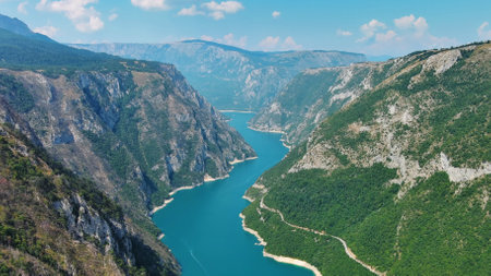 Aerial view of Beautiful Piva river canyon with reservoir Piva Lake (Pivsko Jezero) summer view in...