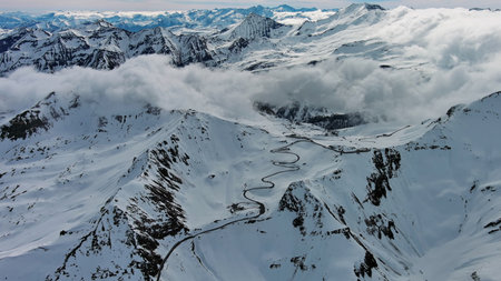 Aerial view of Grossgloknerstrasse in snow. Great high mountain road near Grossglokner mount in...
