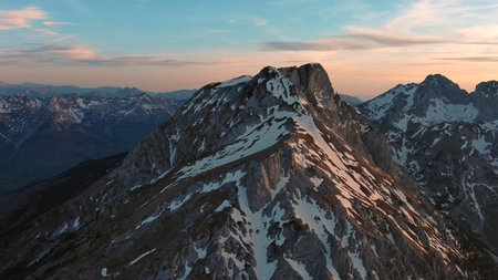 Aerial view of amazing rocky mountains in snow at sunset, Komovi, Montenegroの写真素材