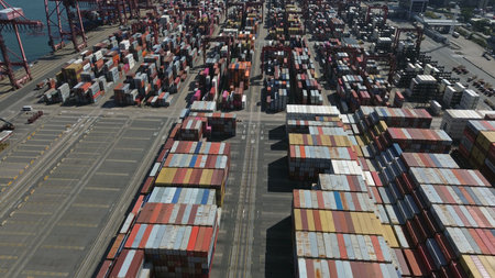 Aerial view of busy shipping port with colorful containers organized in rows, Hong Kongの写真素材