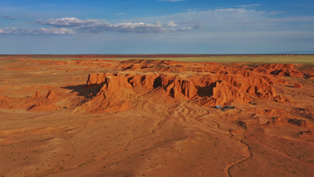 Aerial view of the Bayanzag flaming cliffs at sunset in Mongolia, found in the Gobi Desertの写真素材