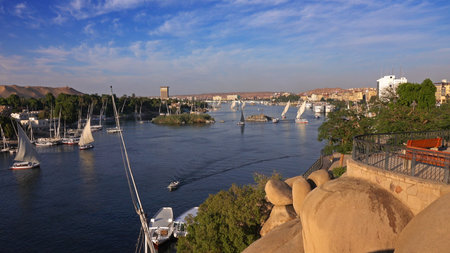 Beautiful landscape with felucca boats on Nile river in Aswan at sunset, Egypt, timelapse