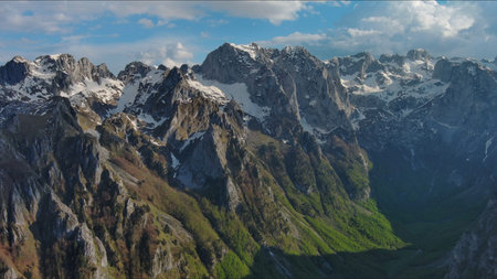 Aerial view of amazing rocky mountains in snow before sunset, Prokletie, Montenegro