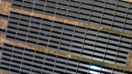 Aerial view of solar power station. Sustainable renewable energy and modern photovoltaic panel...