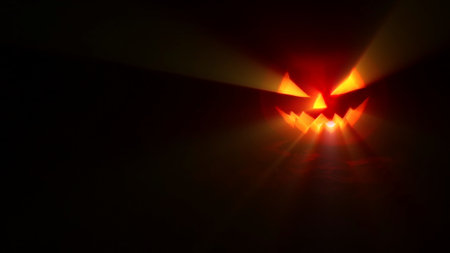 Jack-o-lantern - Halloween pumpkin with candle against a dark background with light rays, in a...