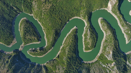 Aerial top view of curved meanders in canyon of Uvac river, Serbiaの写真素材