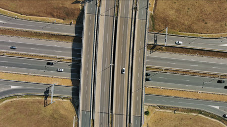 Aerial top view of road interchange or highway intersection. Junction network of transportation