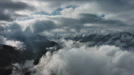 Aerial high view of dramatic clouds and sun