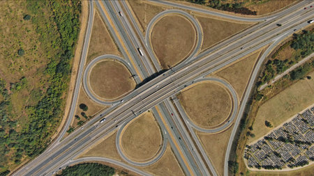 Aerial top view of road interchange or highway intersection. Junction network of transportation