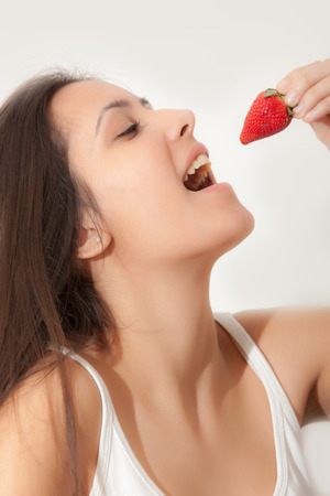Young Girl and strawberryの写真素材
