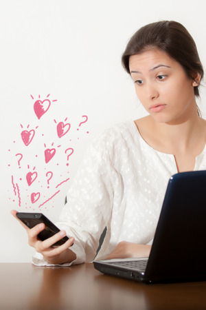 Young girl and love phoneの写真素材