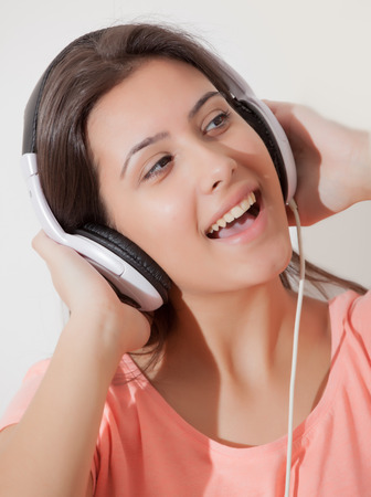 Young girl listening musicの写真素材